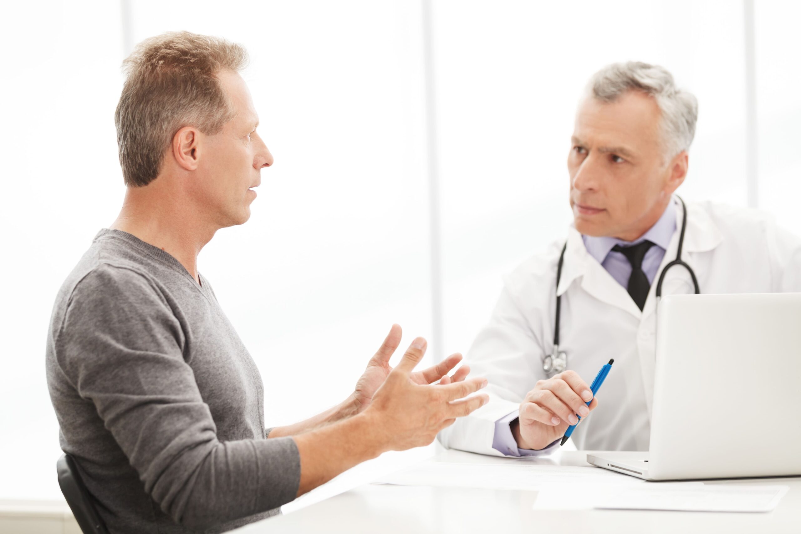 Man talking to his urologist.
