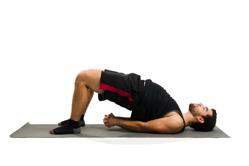 man doing bridge exercise.